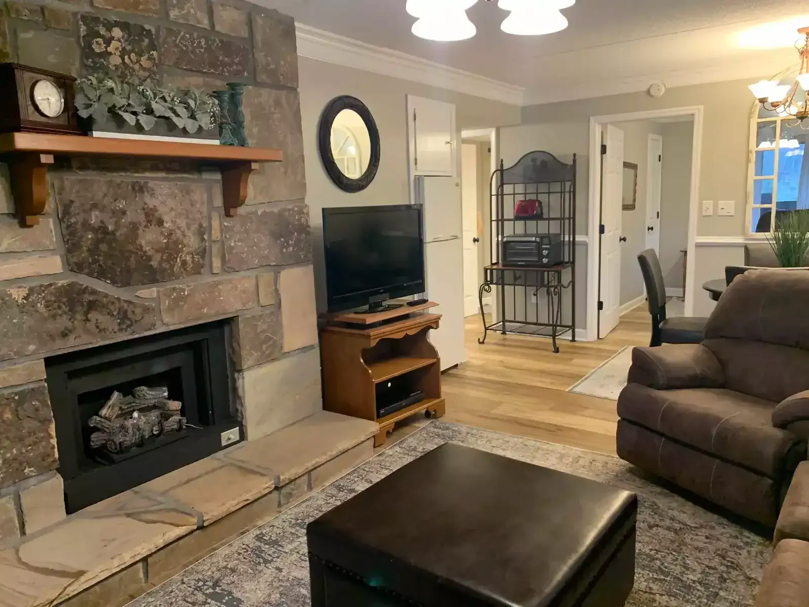 living area with stone fireplace