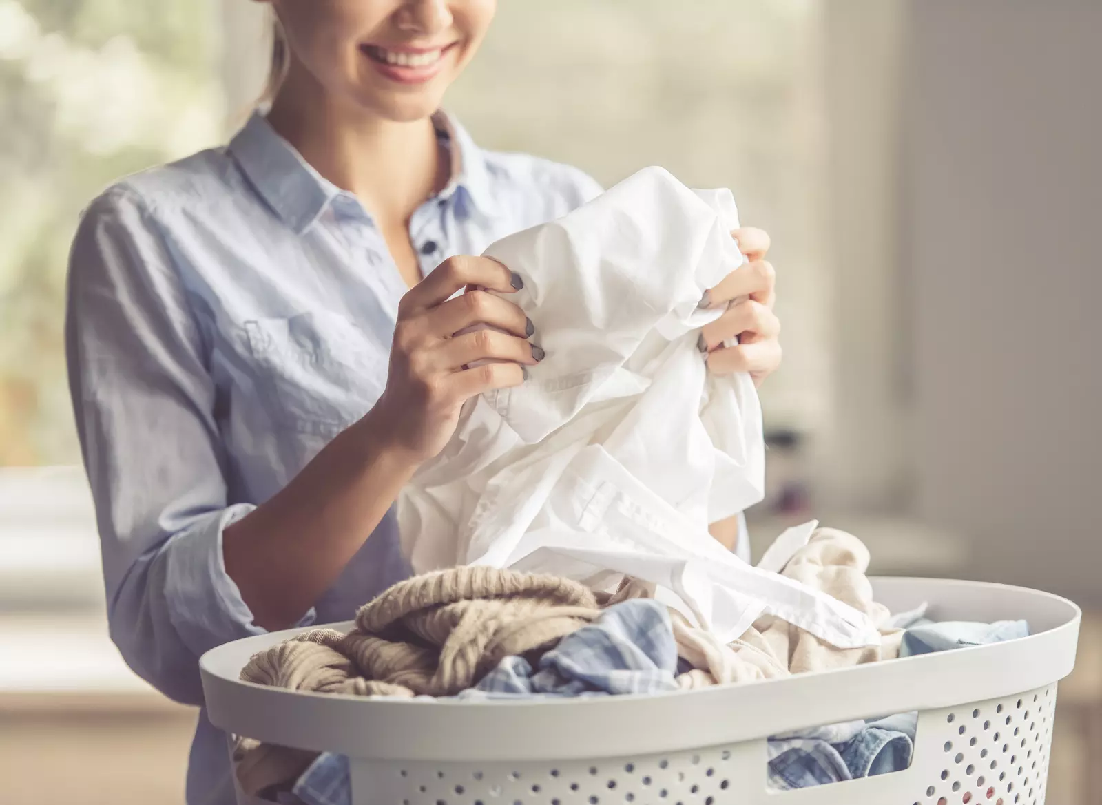 person folding laundry