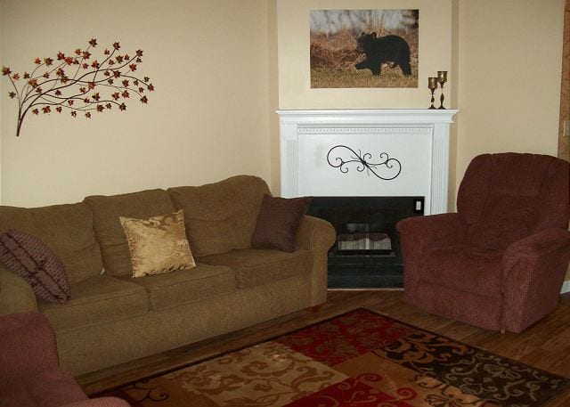 living room with fireplace in Olde Gatlinburg Place condominium